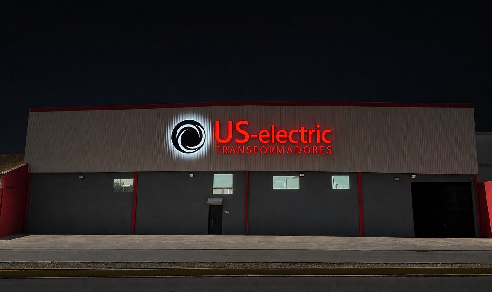 US Electric plant facade at night, sign lit up — Guadalupe, N.L.